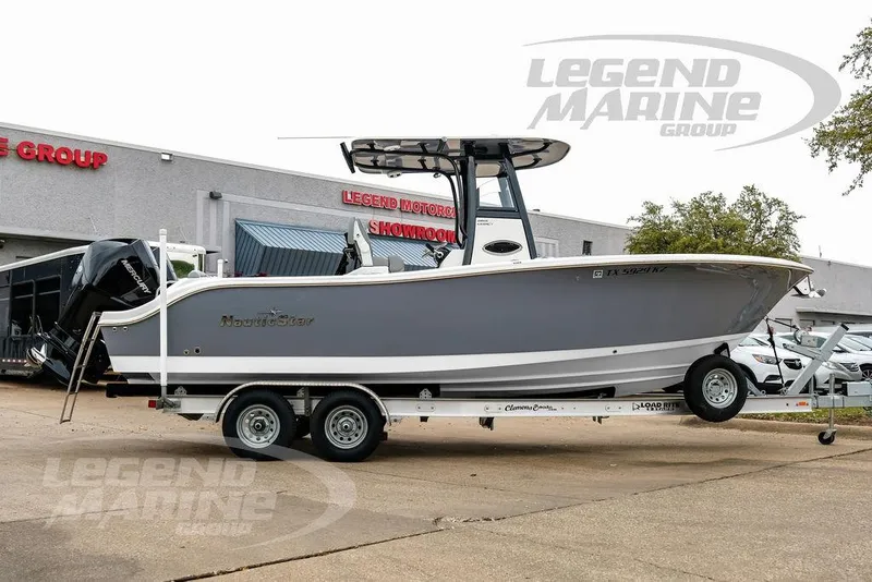 Slide: The Image of 2022 NauticStar 2602 Legacy boat on trailer at Legend Marine Group showroom. - 7