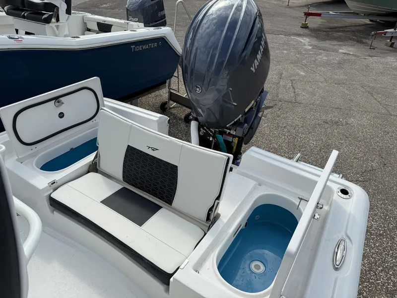 Slide: The Image of 2025 Tidewater 2210 Carolina Bay boat with Yamaha outboard motor and seating area. - 6