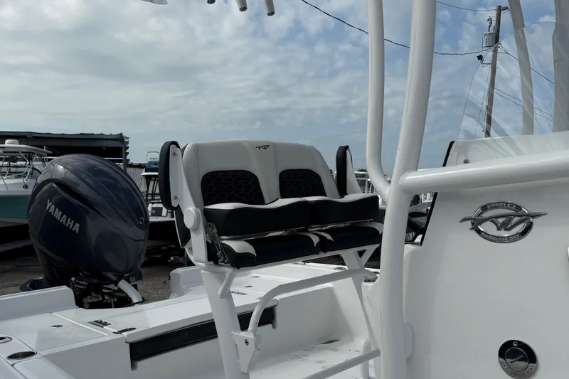 Slide: The Image of 2025 Tidewater 2210 Carolina Bay boat with Yamaha engine, featuring comfortable seating. - 9