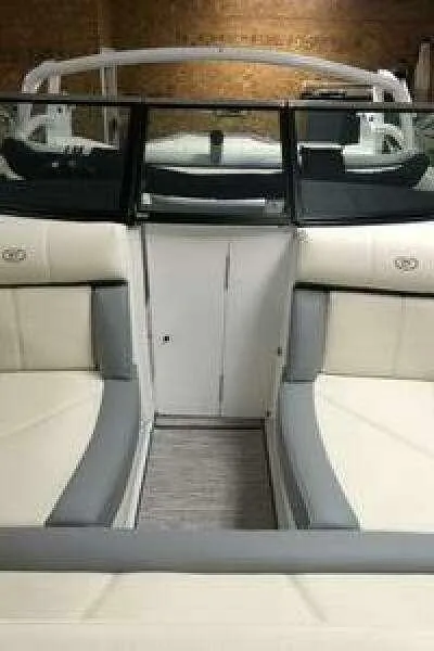 Slide: The Image of 2022 Cobalt CS22 boat interior with beige and gray seating. - 14
