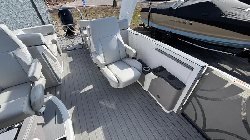 Slide: The Image of 2025 Balise Helix 24C boat interior with modern seating and steering console. - 10