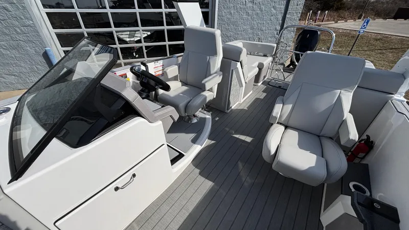 Slide: The Image of 2025 Balise Helix 24C boat interior with modern seating and control panel. - 11