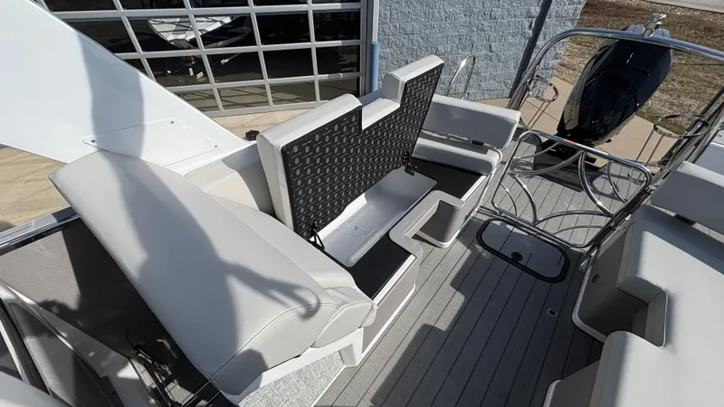 Slide: The Image of 2025 Balise Helix 24C boat interior with seating and storage compartment. - 15