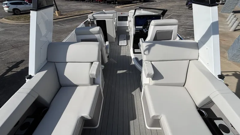 Slide: The Image of 2025 Balise Helix 24C boat dashboard with modern steering and dual displays. - 18