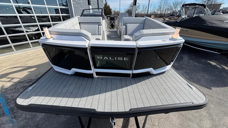 Slide: The Image of 2025 Balise Helix 24C boat with sleek design, spacious seating, and modern features. - 2