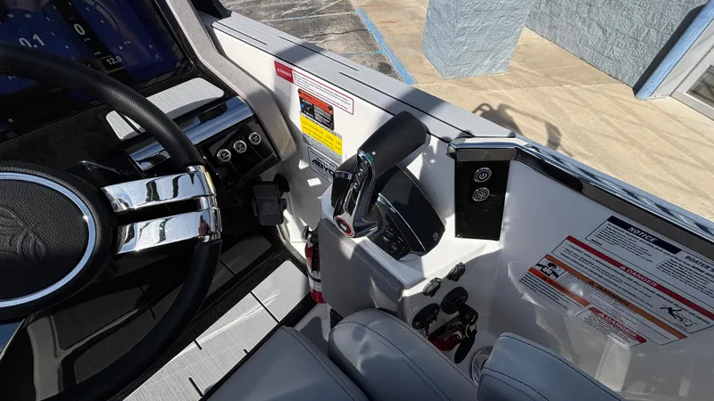 Slide: The Image of 2025 Balise Helix 24C boat interior with modern seating and control panel. - 22