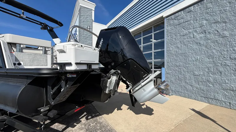 Slide: The Image of 2025 Balise Helix 24C boat on trailer, parked outdoors under clear blue sky. - 27