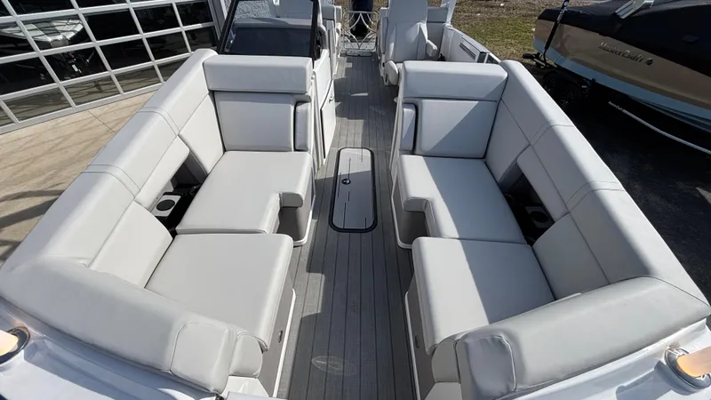 Slide: The Image of 2025 Balise Helix 24C boat interior with white seating and modern design. - 4