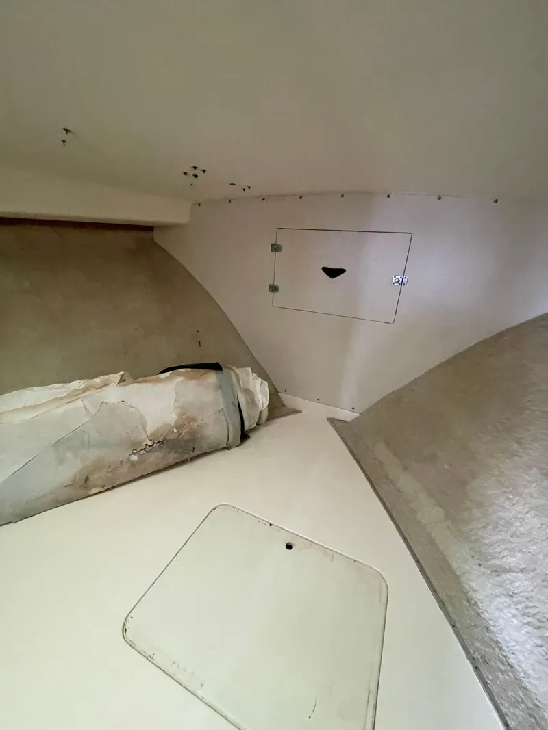 Slide: The Image of 1978 Bertram 33 Flybridge Cruiser interior cabin with storage compartment. - 29