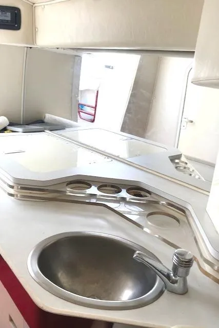 Slide: The Image of 2006 Fountain 42 Executioner boat interior with sink and countertop. - 11