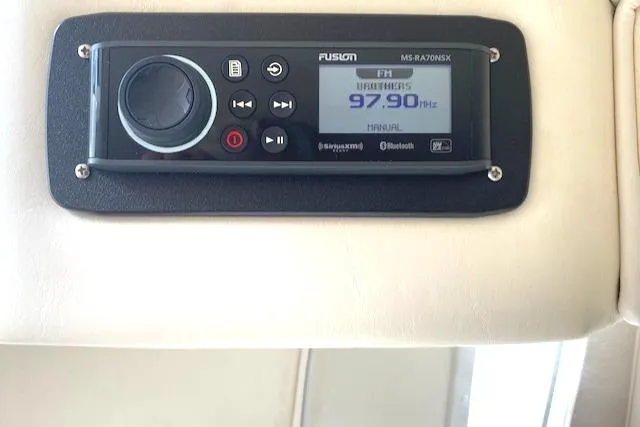 Slide: The Image of Fusion marine stereo system on a 2006 Fountain 42 Executioner boat dashboard. - 12