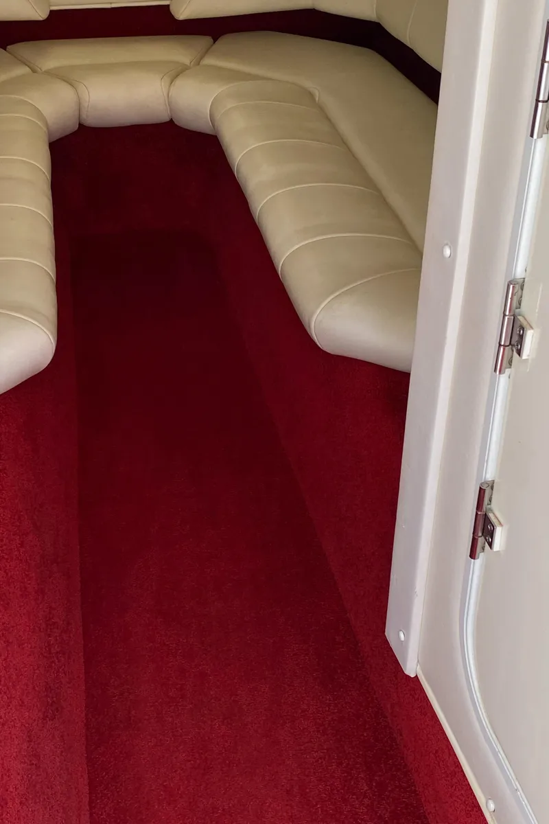 Slide: The Image of 2006 Fountain 42 Executioner interior with red carpet and white seating. - 5