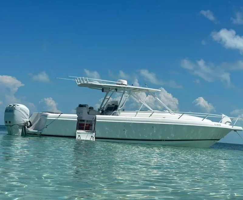 Slide: The Image of 2005 Intrepid 355 boat floating on clear water under a blue sky. - 4