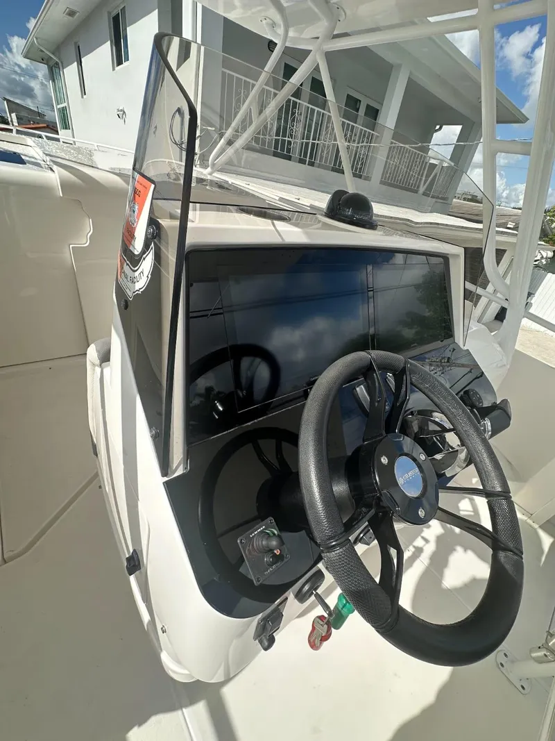 Slide: The Image of 2005 Intrepid 355 boat helm with steering wheel and navigation equipment. - 5