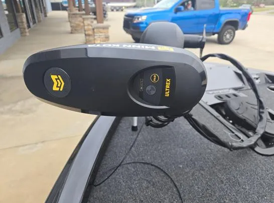 Slide: The Image of Minn Kota Ultrex motor on 2025 Vexus AVX1980 boat, parked near a blue truck. - 3