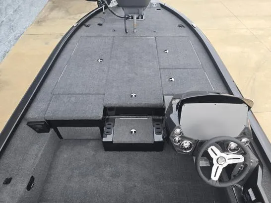 Slide: The Image of 2025 Vexus AVX1980 boat interior with steering wheel and spacious deck layout. - 5