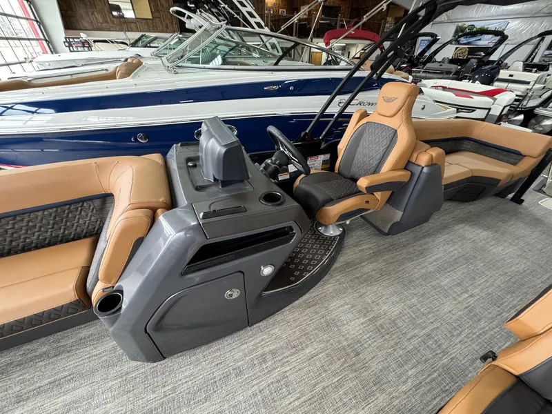 Slide: The Image of 2025 Bennington 24 MFB boat interior with luxurious seating and modern helm design. - 5
