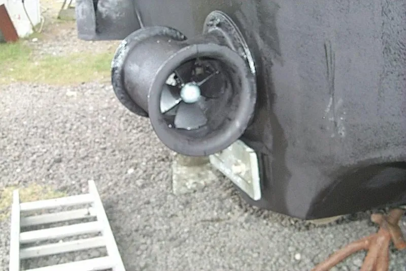 Slide: The Image of 2004 Novatec Islander CPMY boat propeller and hull detail on gravel. - 10