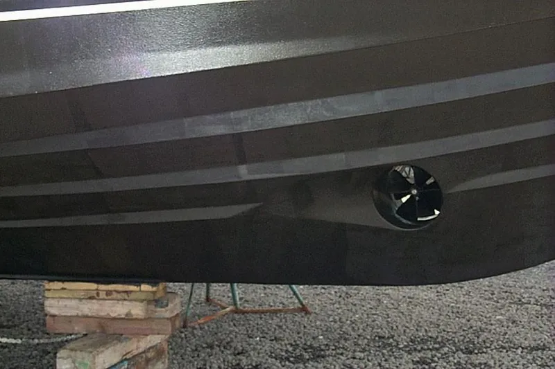 Slide: The Image of 2004 Novatec Islander CPMY boat hull with thruster, supported on blocks. - 12