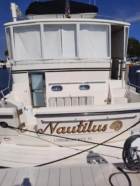 Slide: The Image of 2004 Novatec Islander CPMY yacht docked, featuring "Nautilus" name and Longboat Key, FL location. - 27