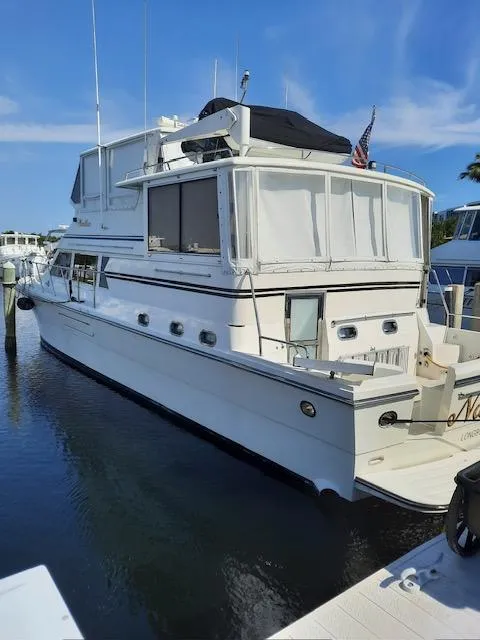 Slide: The Image of 2004 Novatec Islander CPMY yacht docked in marina under clear blue sky. - 29