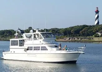 Slide: The Image of 2004 Novatec Islander CPMY yacht cruising near a lighthouse on a sunny day. - 3