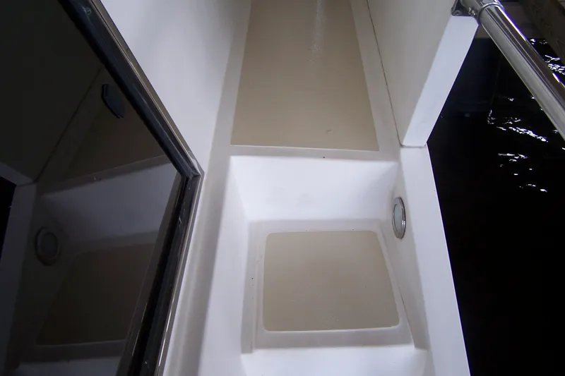 Slide: The Image of 2004 Novatec Islander CPMY boat deck with clean, white surfaces and railing. - 32