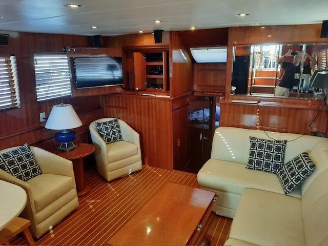 Slide: The Image of Luxurious 2004 Novatec Islander CPMY yacht interior with elegant wood paneling and comfortable seating. - 36