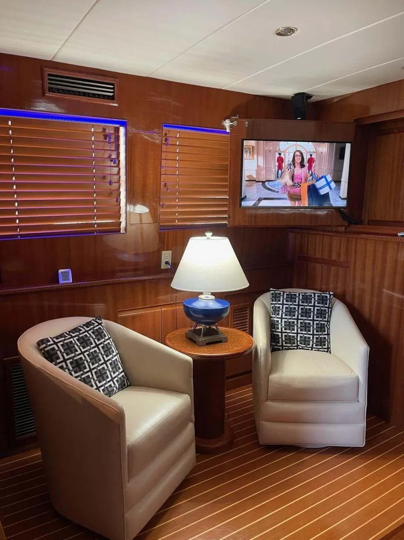 Slide: The Image of Luxurious 2004 Novatec Islander CPMY yacht interior with cozy seating, lamp, and TV. - 37