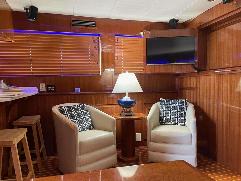 Slide: The Image of Luxurious 2004 Novatec Islander CPMY yacht interior with cozy seating and elegant wood paneling. - 38