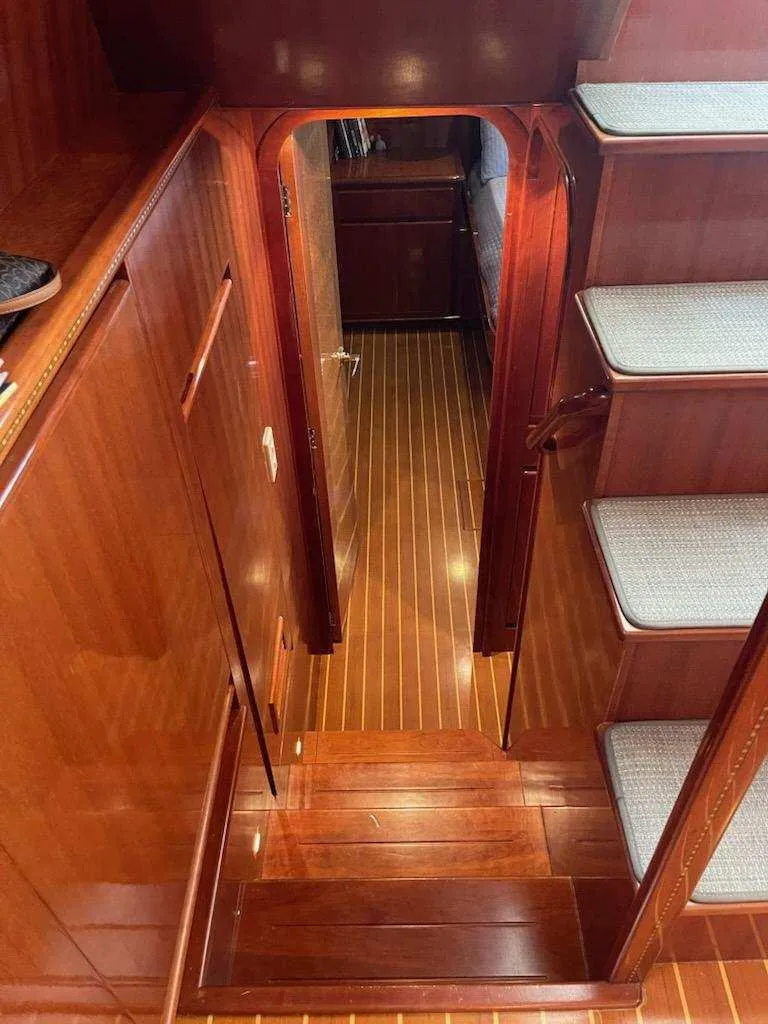 Slide: The Image of 2004 Novatec Islander CPMY interior with polished wood flooring and carpeted stairs. - 42