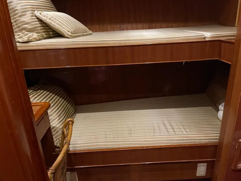 Slide: The Image of Bunk beds in 2004 Novatec Islander CPMY yacht cabin with striped bedding. - 44