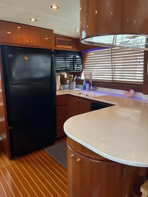 Slide: The Image of 2004 Novatec Islander CPMY yacht kitchen with wood cabinetry and modern appliances. - 45