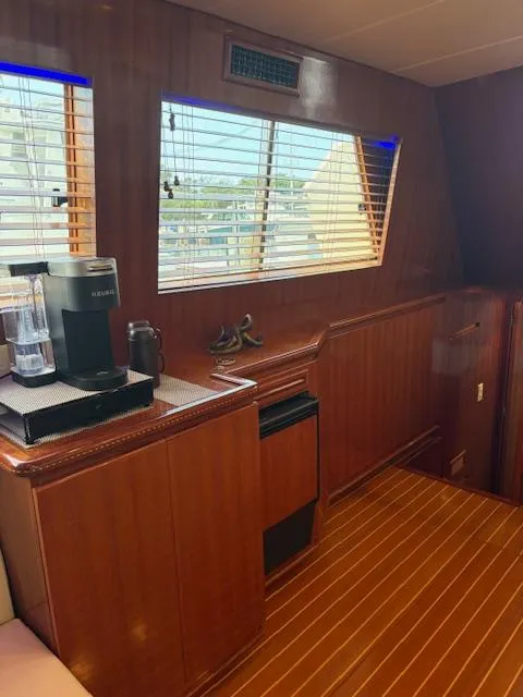 Slide: The Image of 2004 Novatec Islander CPMY interior with wood paneling, coffee maker, and window blinds. - 46