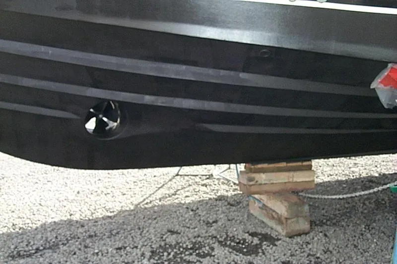 Slide: The Image of 2004 Novatec Islander CPMY boat hull on wooden blocks, showcasing propeller detail. - 8