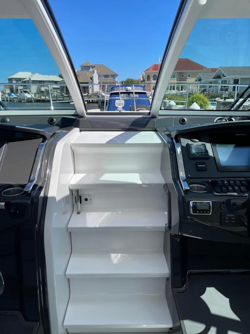 Slide: The Image of 2017 Monterey 360 Sport Coupe interior with beige seating and modern design. - 11