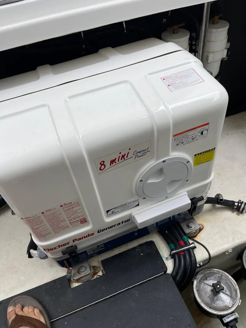 Slide: The Image of 2017 Monterey 360 Sport Coupe with beige seating on a wooden deck. - 16