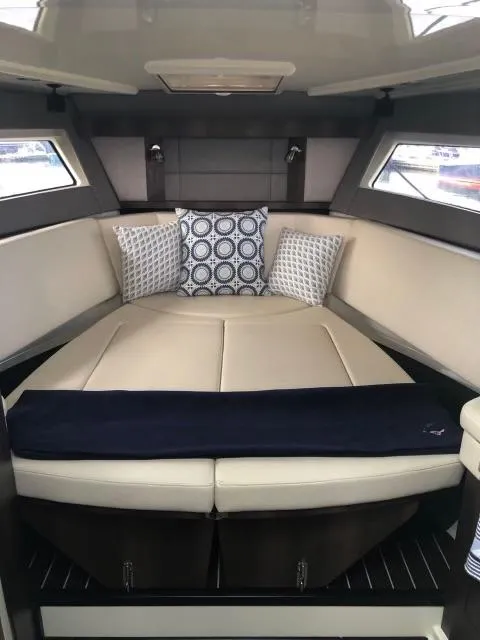 Slide: The Image of Interior cabin of 2017 Monterey 360 Sport Coupe with stylish bedding and cushions. - 28