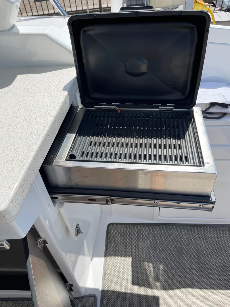 Slide: The Image of Interior of 2017 Monterey 360 Sport Coupe with TV and beige seating. - 7