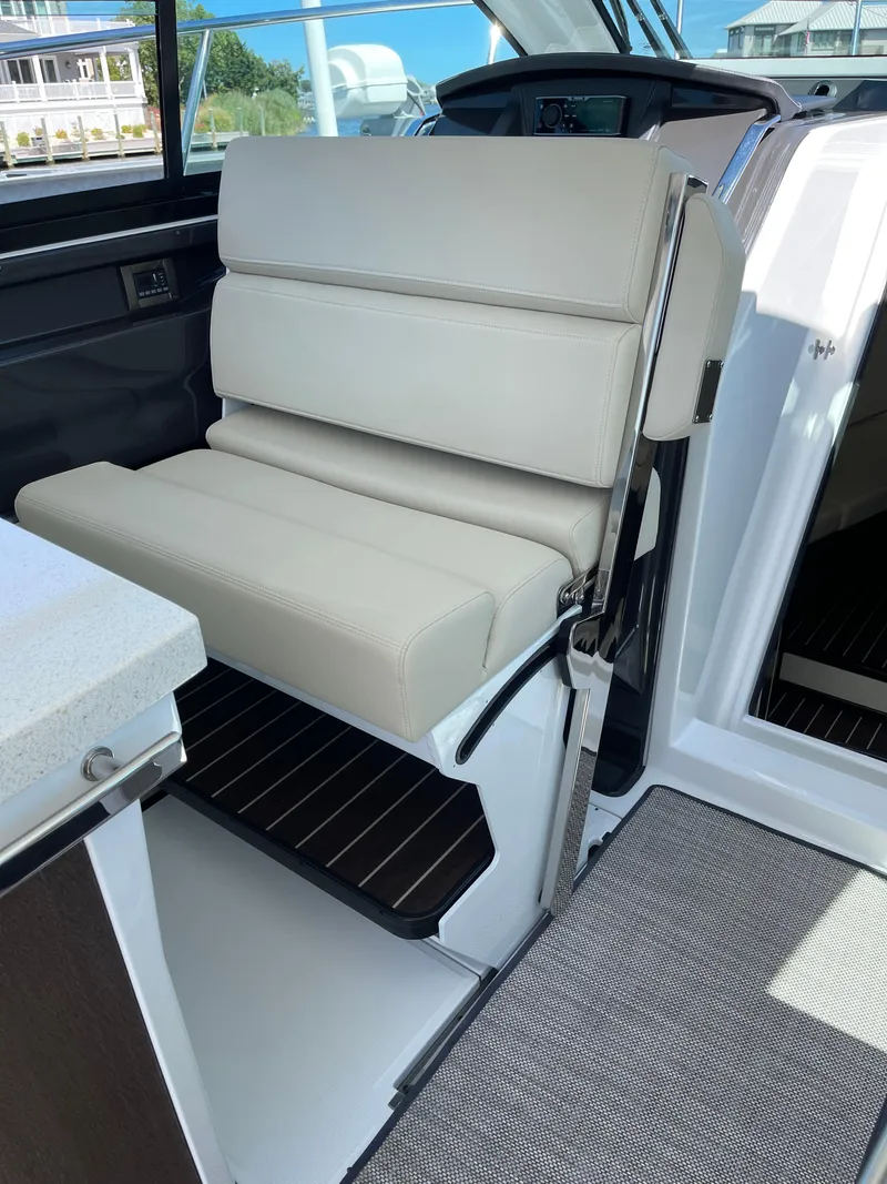 Slide: The Image of Outdoor grill on 2017 Monterey 360 Sport Coupe boat, open lid, ready for use. - 9