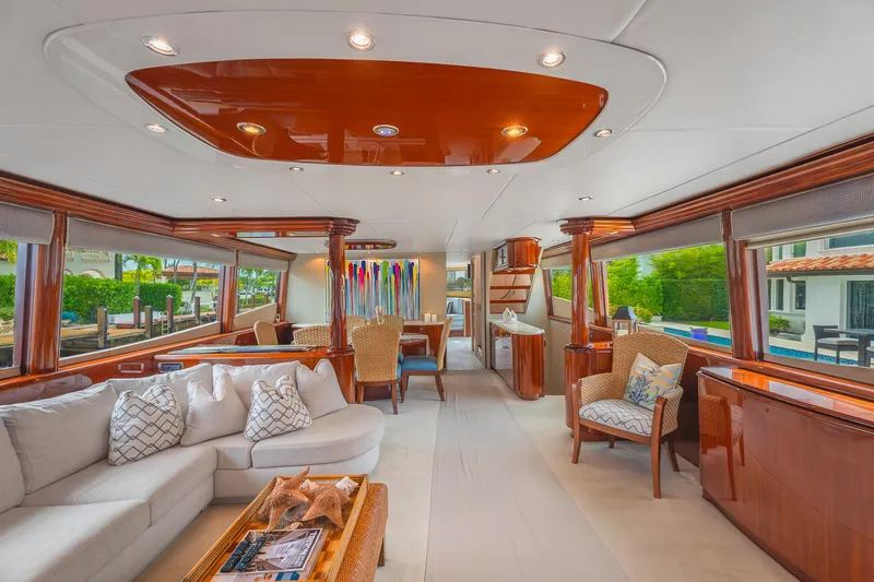 Slide: The Image of Luxurious interior of 2002 Lazzara 80 Skylounge yacht with elegant furnishings and large windows. - 14