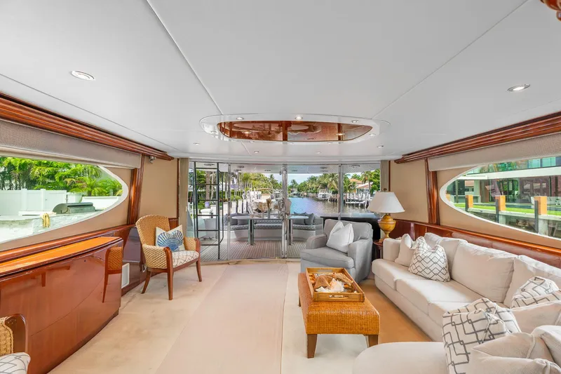 Slide: The Image of Luxurious interior of 2002 Lazzara 80 Skylounge yacht with elegant seating and large windows. - 16