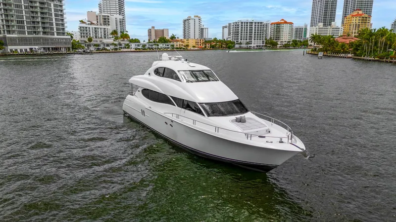 Slide: The Image of Luxury 2002 Lazzara 80 Skylounge yacht cruising in urban waterfront setting. - 2