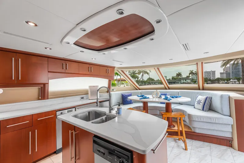 Slide: The Image of Luxurious interior of 2002 Lazzara 80 Skylounge yacht with modern kitchen and dining area. - 20