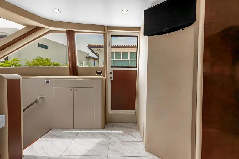 Slide: The Image of Interior of 2002 Lazzara 80 Skylounge yacht with modern design and large windows. - 23