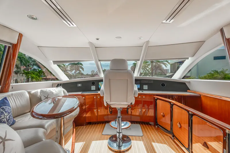 Slide: The Image of Luxurious interior of 2002 Lazzara 80 Skylounge yacht with elegant seating and panoramic windows. - 24