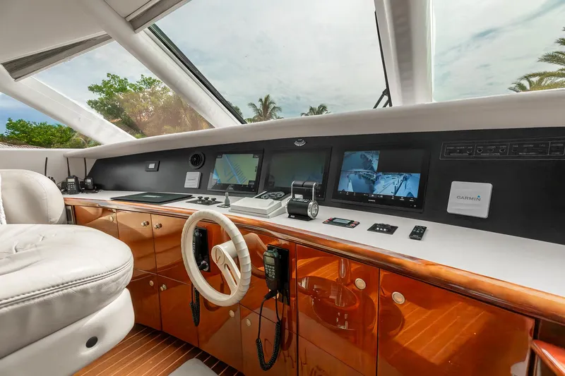 Slide: The Image of Luxurious helm of 2002 Lazzara 80 Skylounge yacht with modern navigation equipment. - 25