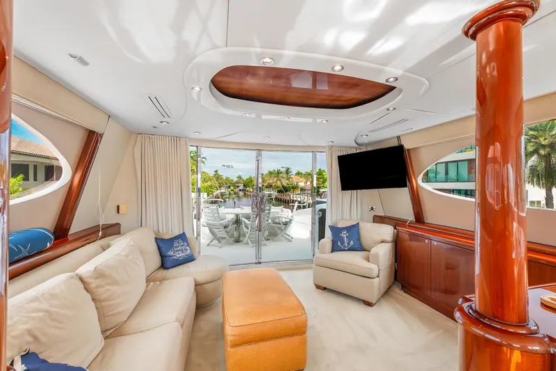 Slide: The Image of Luxurious interior of 2002 Lazzara 80 Skylounge yacht with elegant seating and large windows. - 29