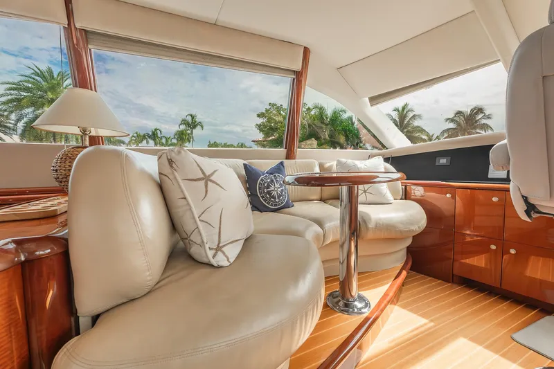 Slide: The Image of Luxurious interior of 2002 Lazzara 80 Skylounge yacht with plush seating and elegant decor. - 30