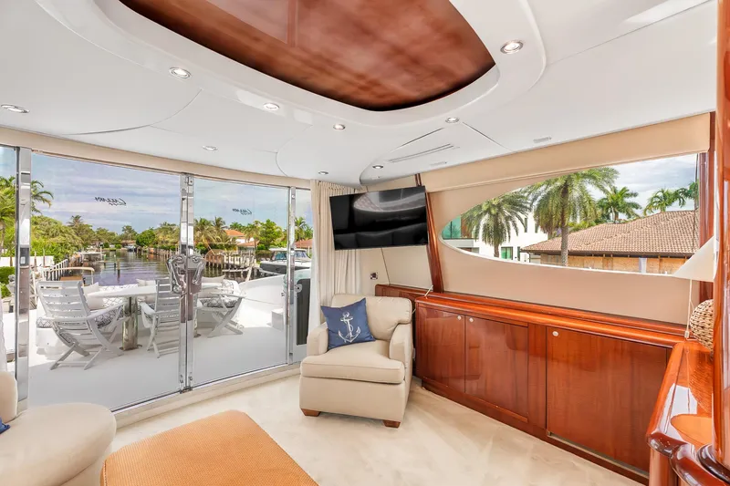 Slide: The Image of Luxurious interior of 2002 Lazzara 80 Skylounge yacht with elegant furnishings and canal view. - 32